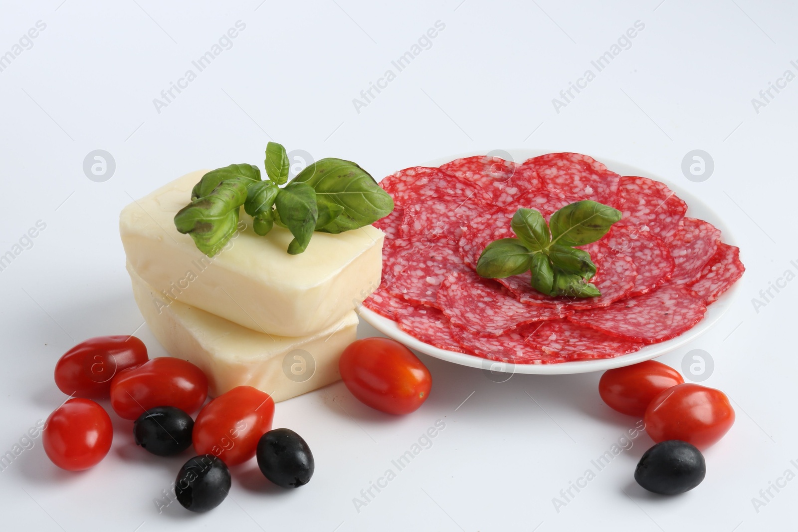 Making pizza. Different ingredients isolated on white Photo of Making pizza. Different ingredients isolated on white