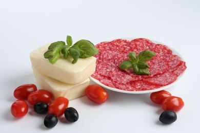 Photo of Making pizza. Different ingredients isolated on white