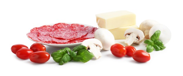 Photo of Making pizza. Different ingredients isolated on white