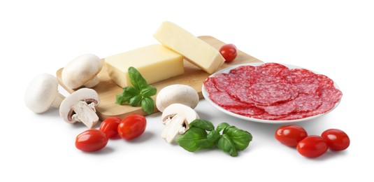 Photo of Making pizza. Different ingredients isolated on white