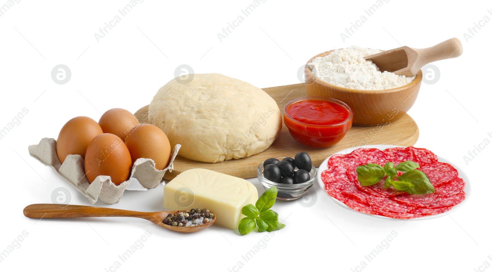 Making pizza. Different ingredients isolated on white Photo of Making pizza. Different ingredients isolated on white