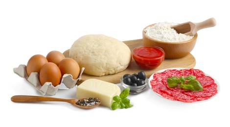Photo of Making pizza. Different ingredients isolated on white