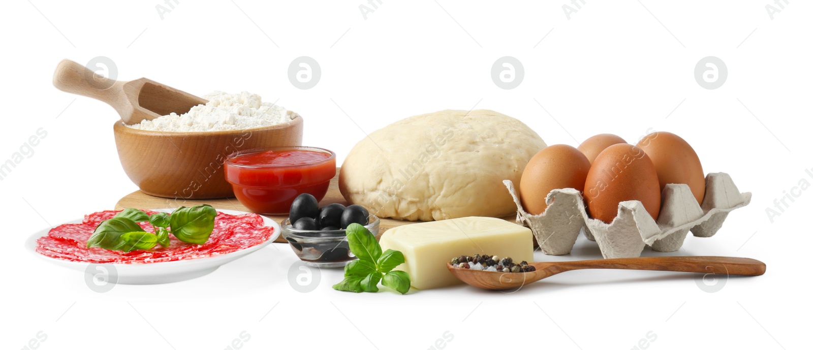 Making pizza. Different ingredients isolated on white Photo of Making pizza. Different ingredients isolated on white