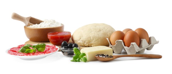 Photo of Making pizza. Different ingredients isolated on white