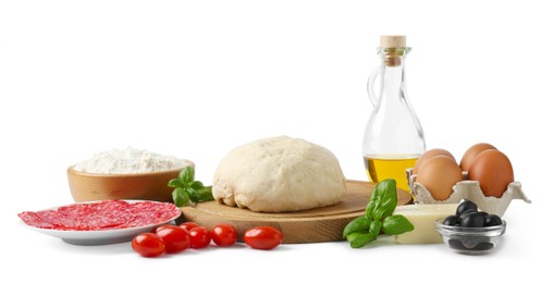 Photo of Making pizza. Different ingredients isolated on white