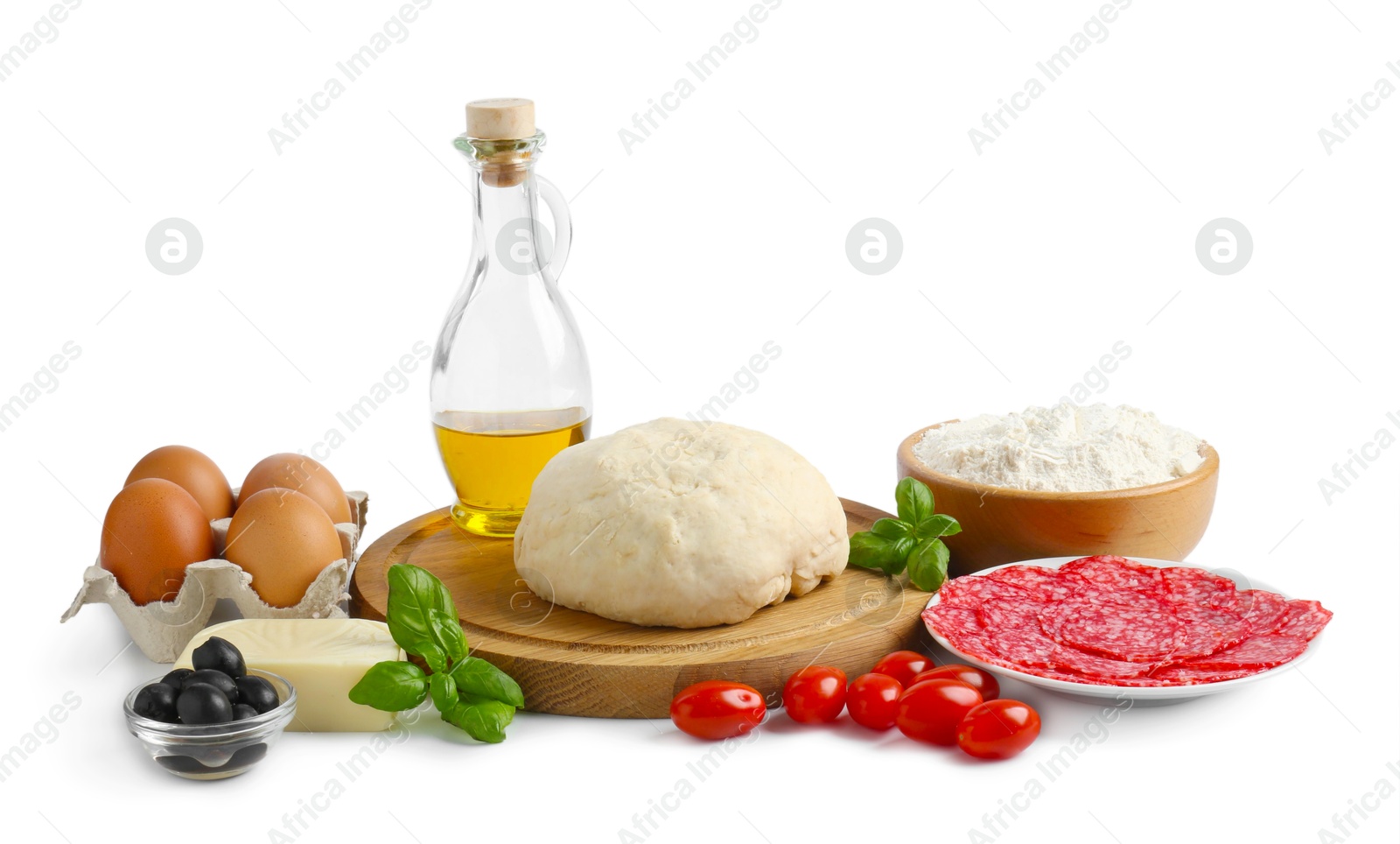 Making pizza. Different ingredients isolated on white Photo of Making pizza. Different ingredients isolated on white