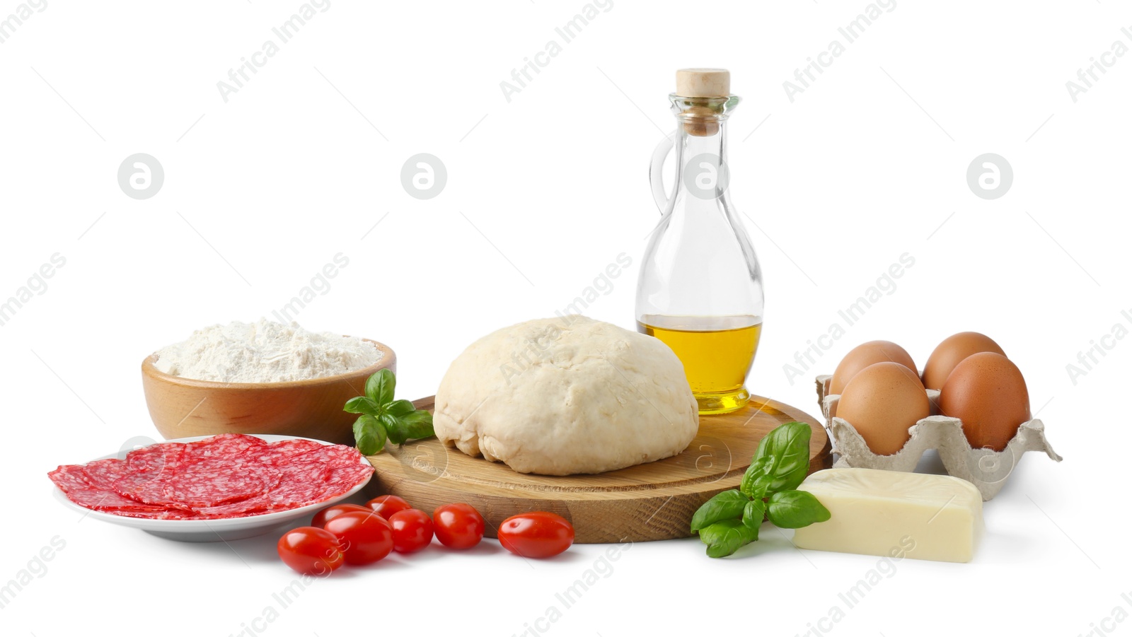Photo of Making pizza. Different ingredients isolated on white