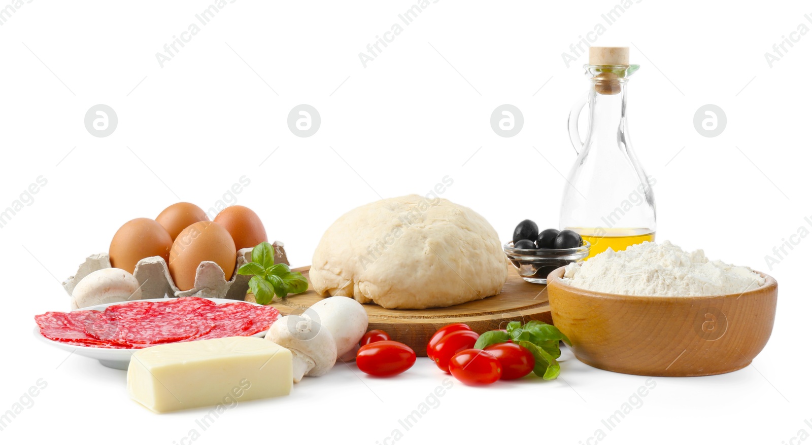 Making pizza. Different ingredients isolated on white Photo of Making pizza. Different ingredients isolated on white