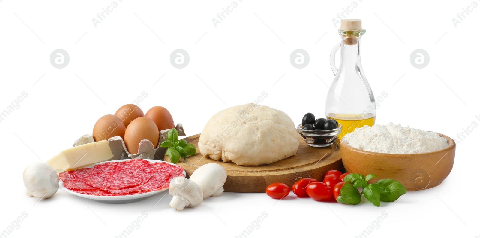 Photo of Making pizza. Different ingredients isolated on white