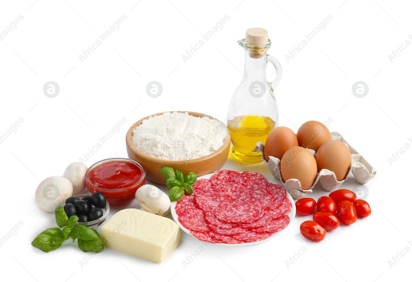 Making pizza. Different ingredients isolated on white Photo of Making pizza. Different ingredients isolated on white