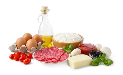 Photo of Making pizza. Different ingredients isolated on white
