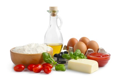 Photo of Making pizza. Different ingredients isolated on white