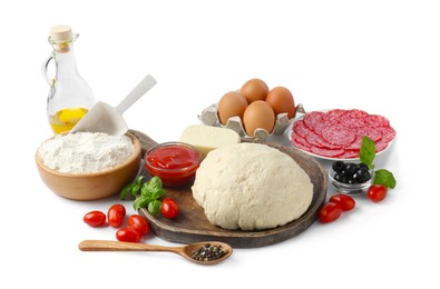 Photo of Making pizza. Different ingredients isolated on white