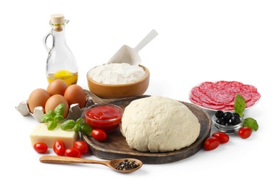 Photo of Making pizza. Different ingredients isolated on white
