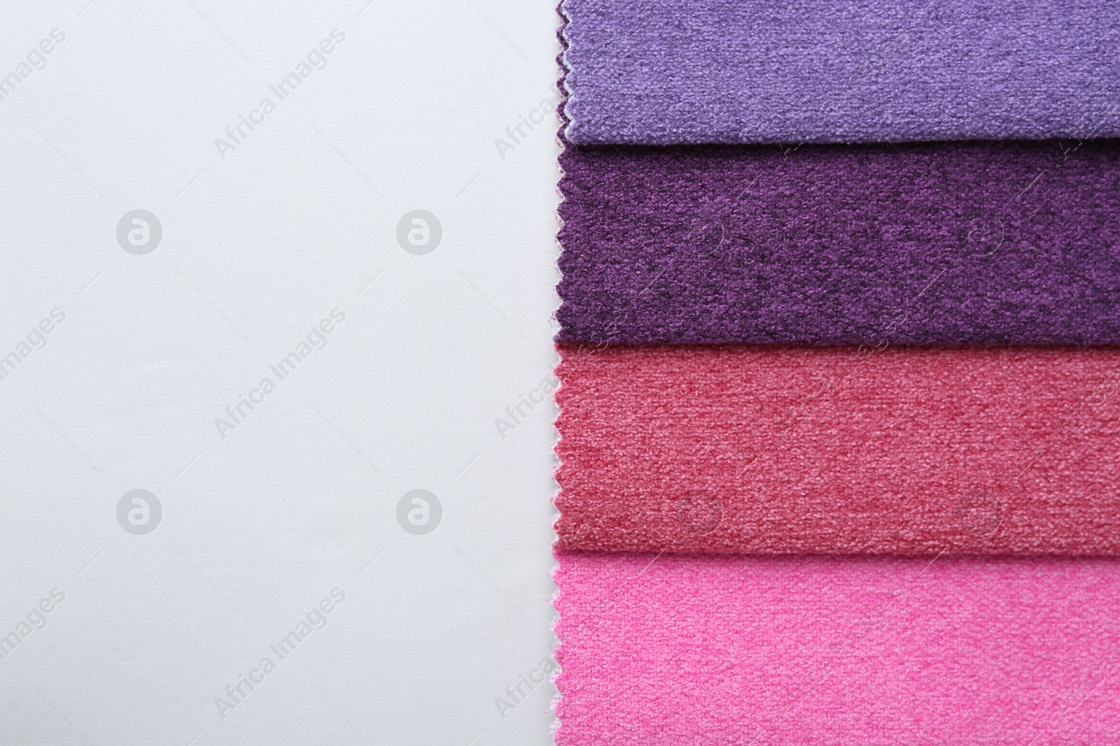 Samples of different fabrics on white background, top view. Space for text Photo of Samples of different fabrics on white background, top view. Space for text