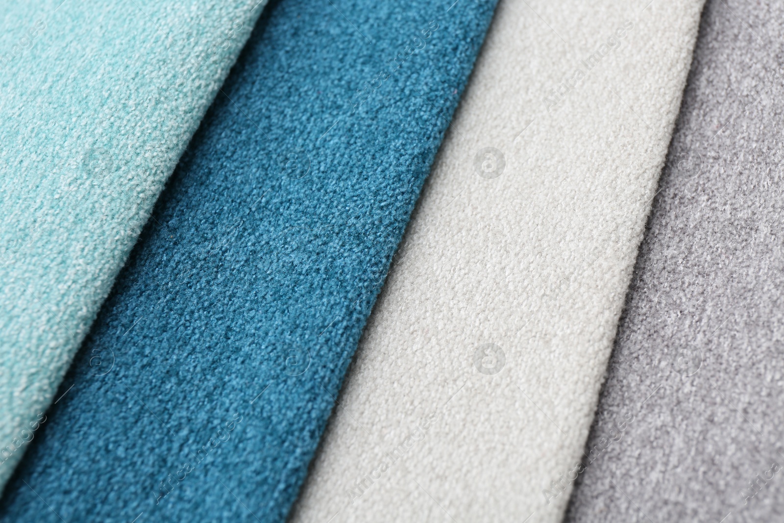 Samples of different fabrics as background, closeup Photo of Samples of different fabrics as background, closeup