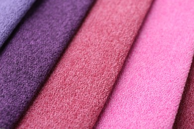 Photo of Samples of different fabrics as background, closeup
