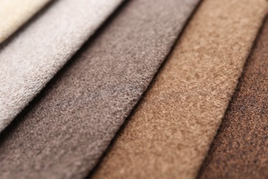 Photo of Samples of different fabrics as background, closeup