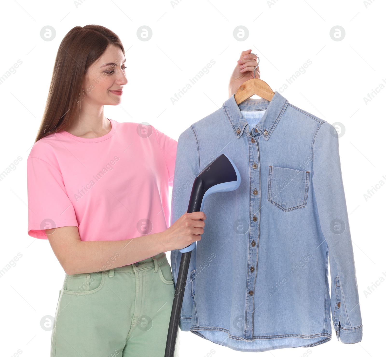 Beautiful woman steaming shirt on white background Photo of Beautiful woman steaming shirt on white background