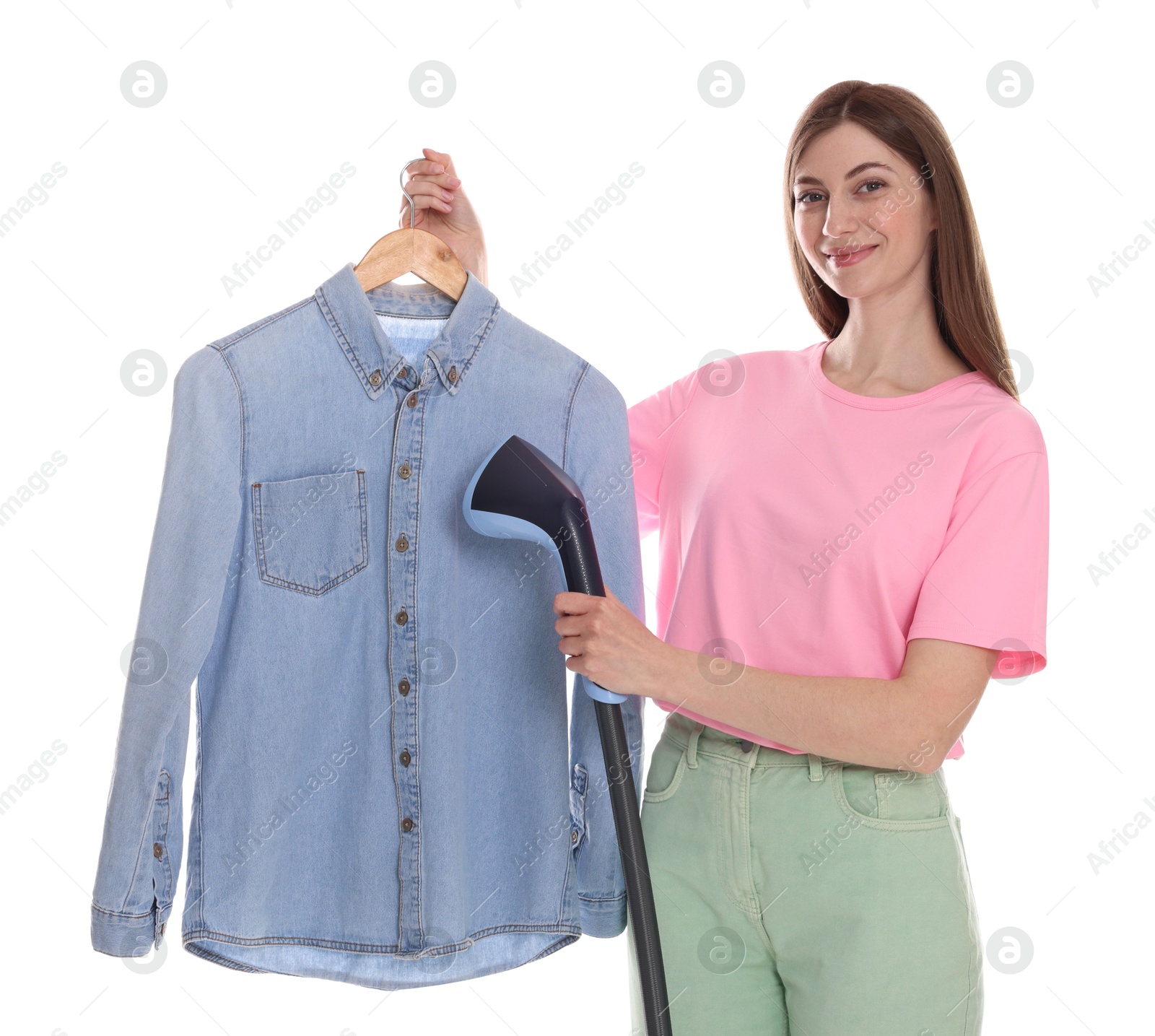 Beautiful woman steaming shirt on white background Photo of Beautiful woman steaming shirt on white background