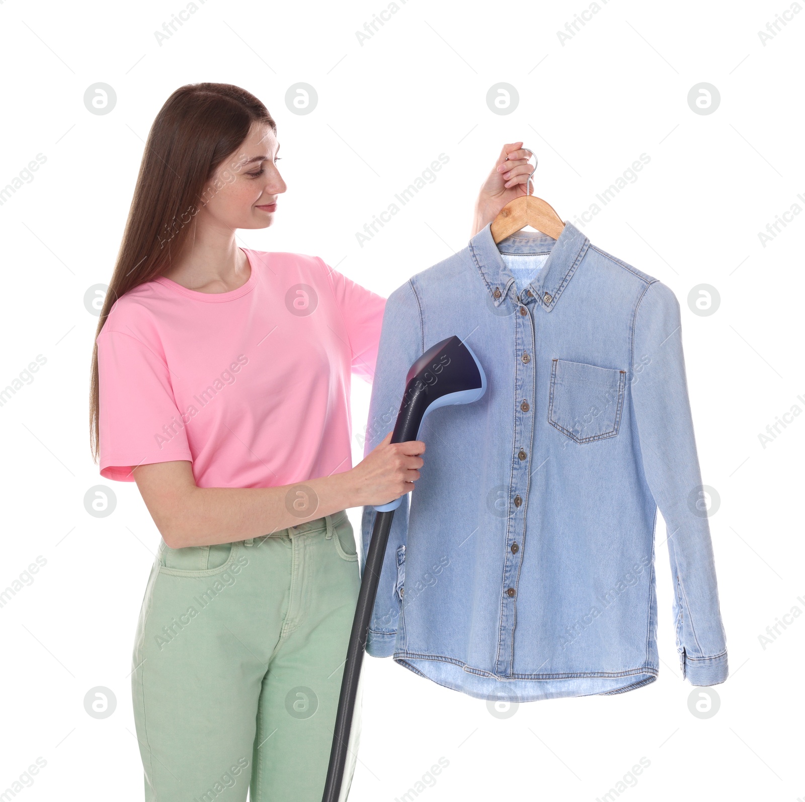 Photo of Beautiful woman steaming shirt on white background