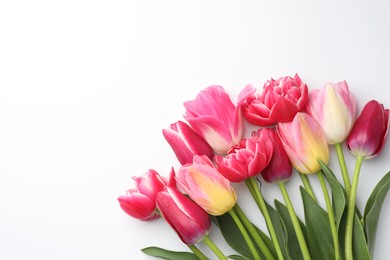 Photo of Beautiful tulips on white background, flat lay. Space for text