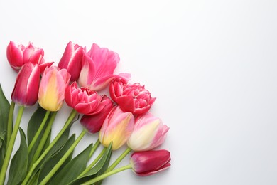Photo of Beautiful tulips on white background, flat lay. Space for text