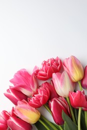 Photo of Beautiful tulips on white background, flat lay. Space for text
