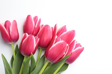 Photo of Beautiful tulips on white background, flat lay. Space for text