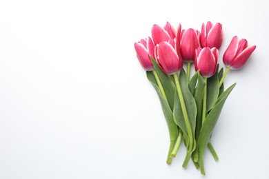 Photo of Beautiful tulips on white background, flat lay. Space for text
