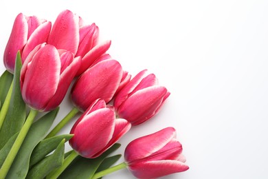 Photo of Beautiful tulips on white background, flat lay. Space for text