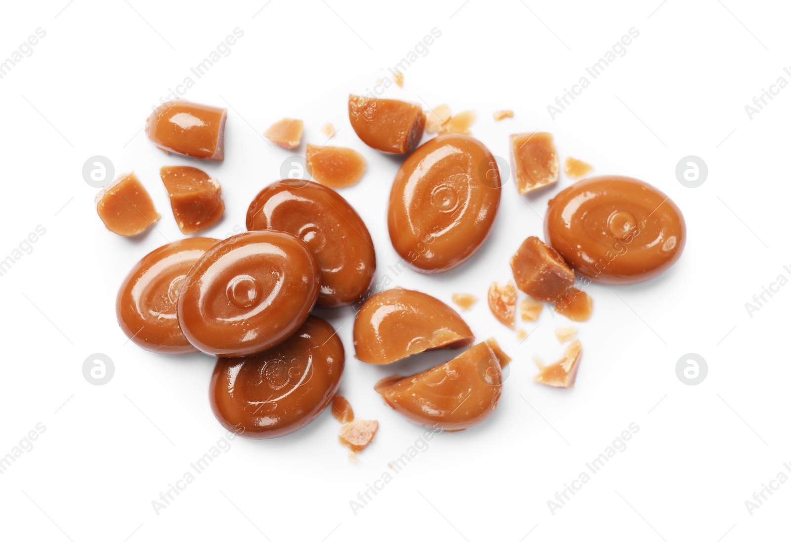 Broken tasty caramel candies isolated on white, top view Photo of Broken tasty caramel candies isolated on white, top view