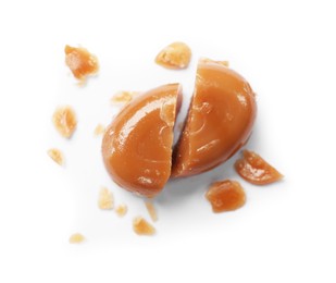 Photo of Broken caramel candy isolated on white, top view