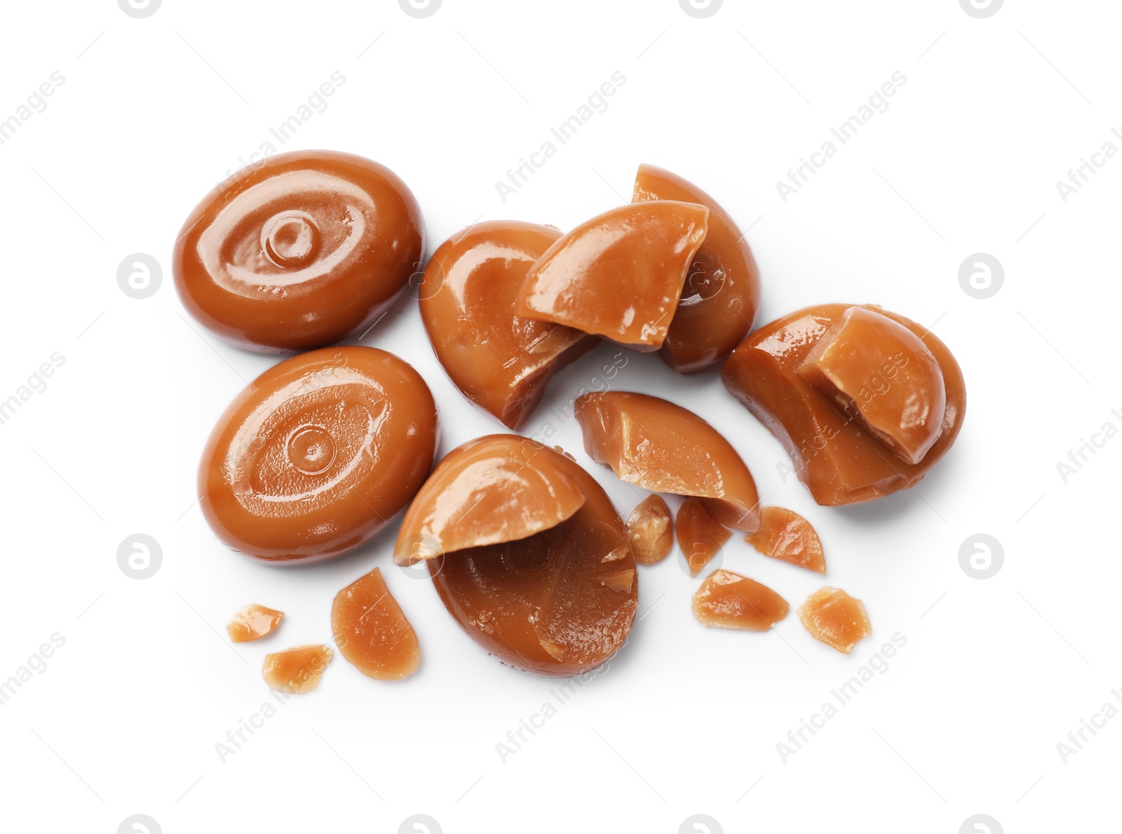 Broken tasty caramel candies isolated on white, top view Photo of Broken tasty caramel candies isolated on white, top view