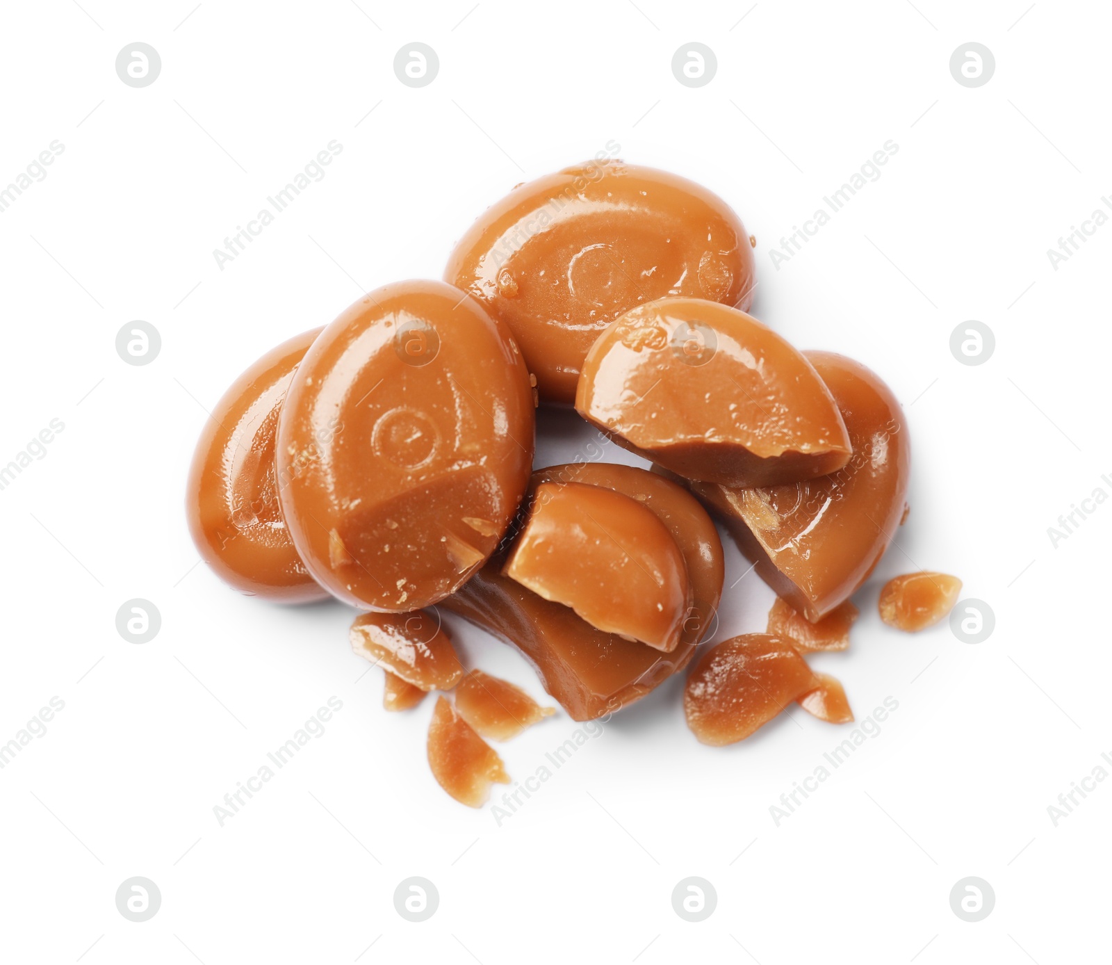 Broken tasty caramel candies isolated on white, top view Photo of Broken tasty caramel candies isolated on white, top view