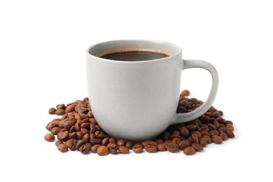 Photo of Aromatic coffee in cup and pile of beans isolated on white