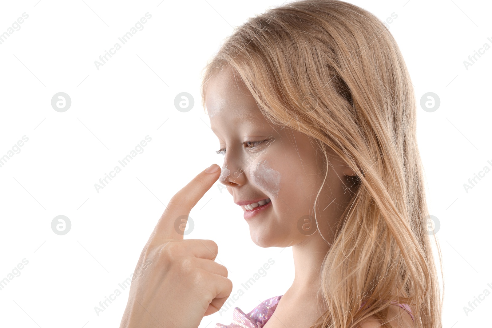 Mother applying sun protection product onto her daughter's nose on white background, closeup Photo of Mother applying sun protection product onto her daughter's nose on white background, closeup