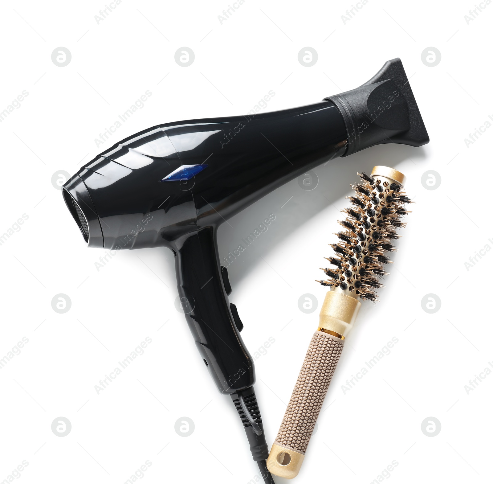 Hair dryer and brush isolated on white, top view. Hairdresser's tools Photo of Hair dryer and brush isolated on white, top view. Hairdresser's tools