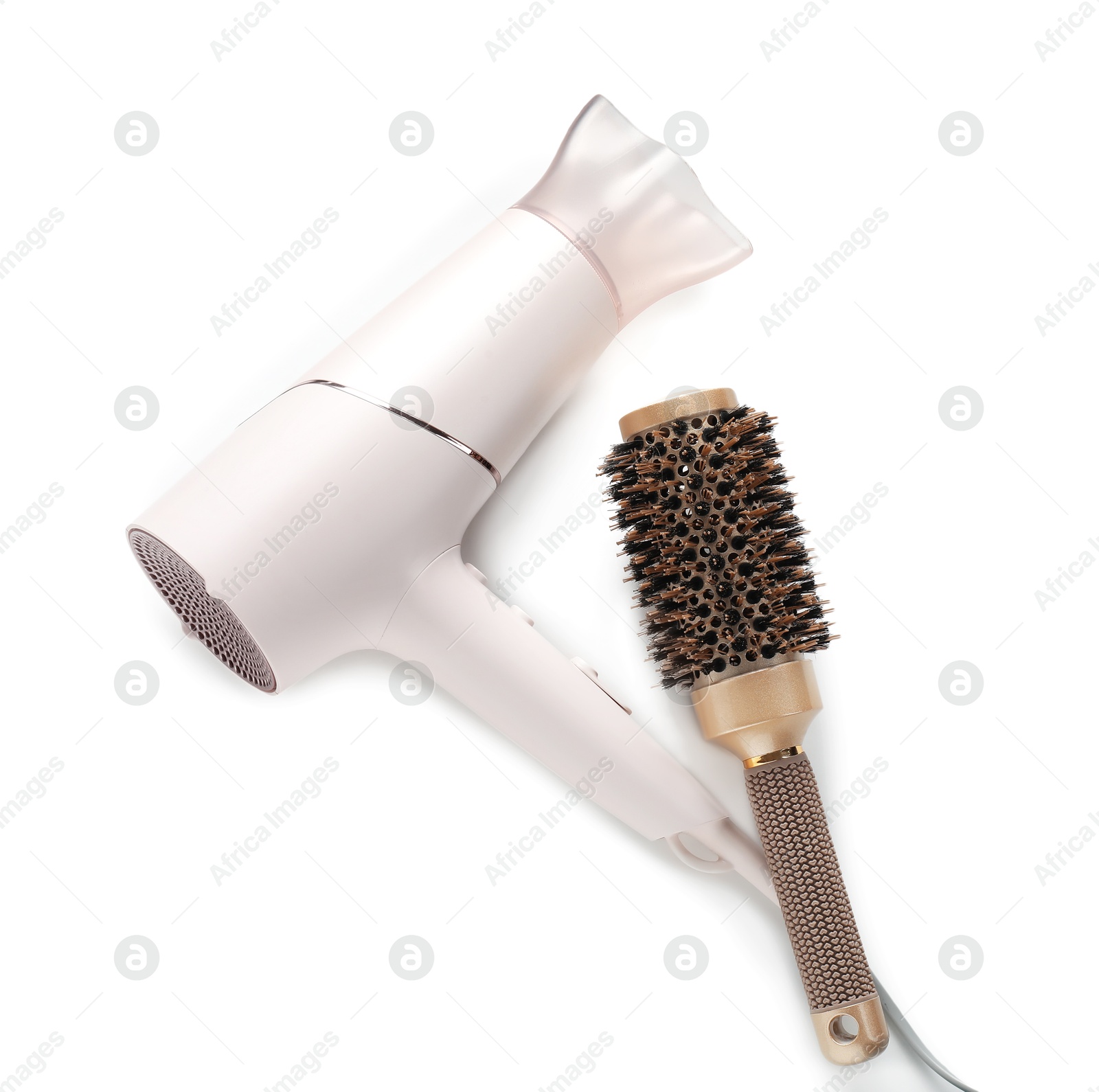 Hair dryer and brush isolated on white, top view. Hairdresser's tools Photo of Hair dryer and brush isolated on white, top view. Hairdresser's tools