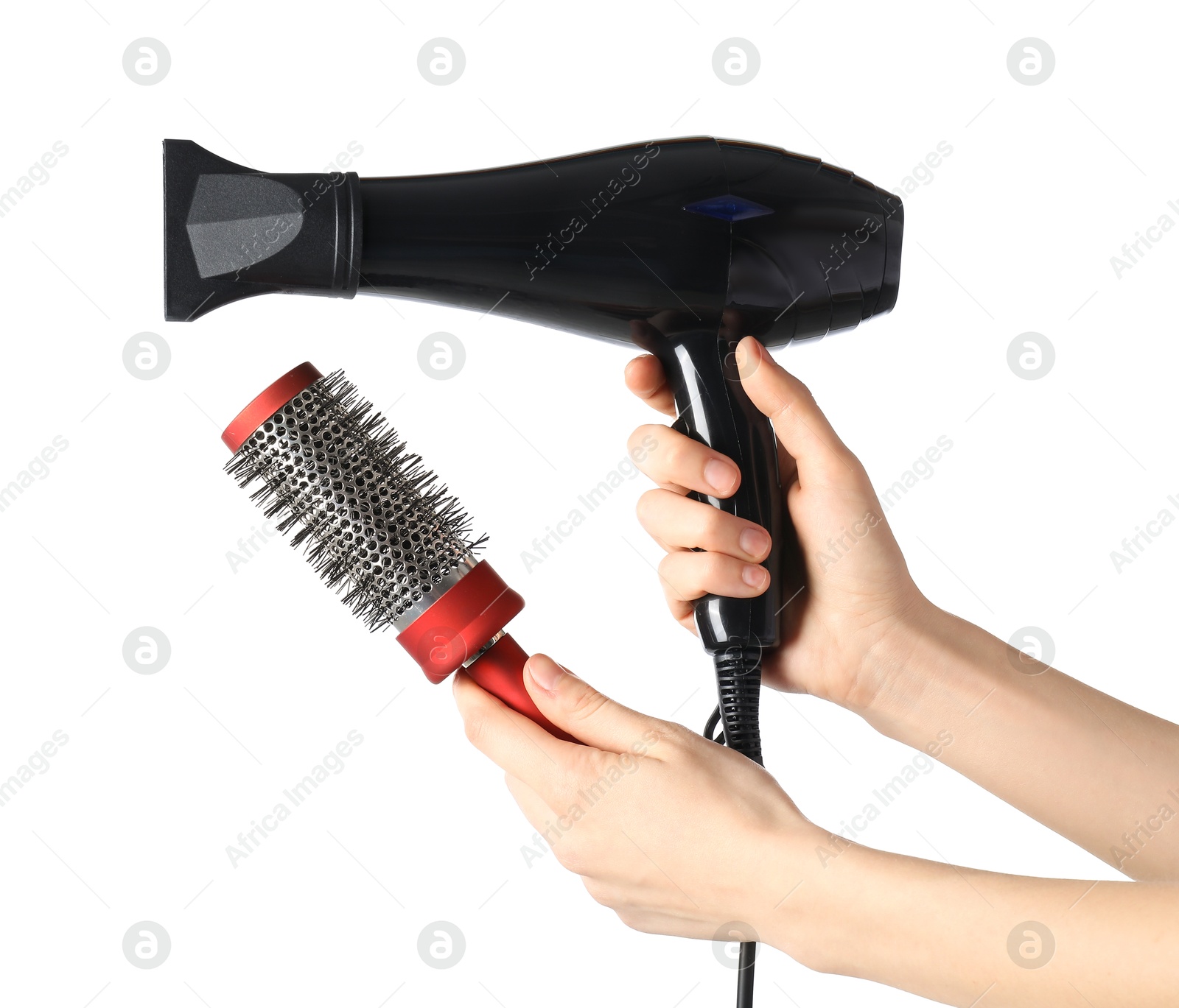 Photo of Woman with hair dryer and round brush on white background, closeup