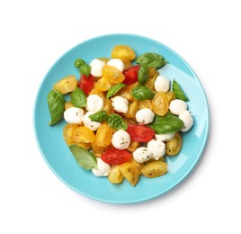 Photo of Tasty salad with yellow tomatoes, basil and mozzarella cheese isolated on white, top view