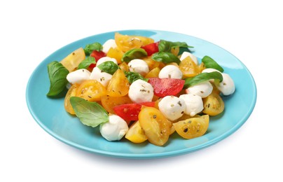 Photo of Tasty salad with yellow tomatoes, basil and mozzarella cheese isolated on white