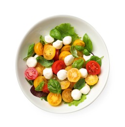 Photo of Tasty salad with yellow tomatoes, basil and mozzarella cheese isolated on white, top view