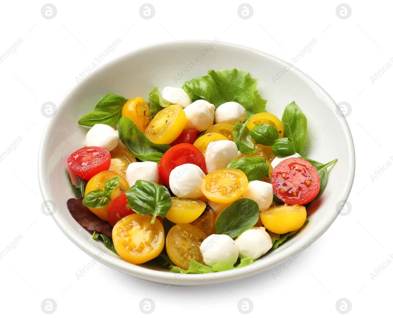 Tasty salad with yellow tomatoes, basil and mozzarella cheese isolated on white Photo of Tasty salad with yellow tomatoes, basil and mozzarella cheese isolated on white