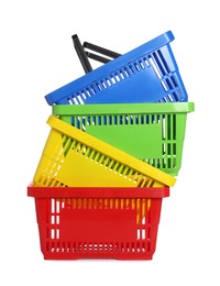 Photo of Stack of colorful shopping baskets isolated on white