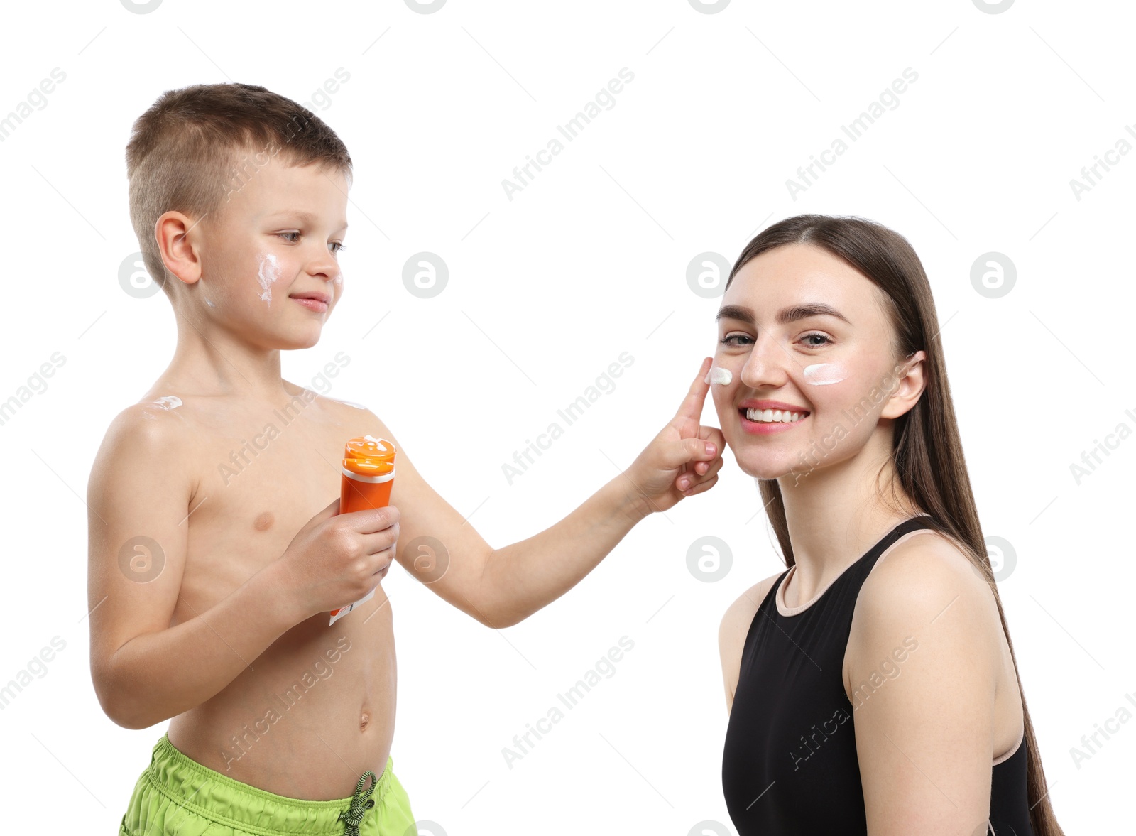 Son applying sun protection cream onto his mother's skin on white background Photo of Son applying sun protection cream onto his mother's skin on white background