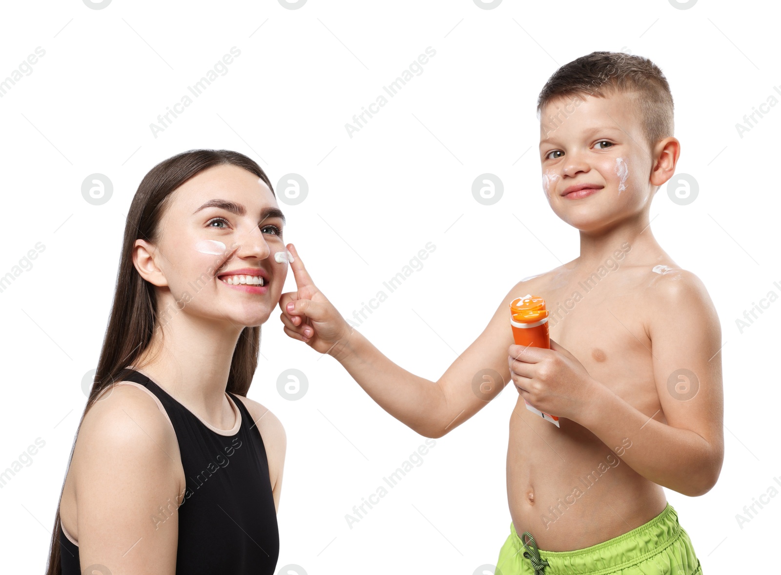 Son applying sun protection cream onto his mother's skin on white background Photo of Son applying sun protection cream onto his mother's skin on white background