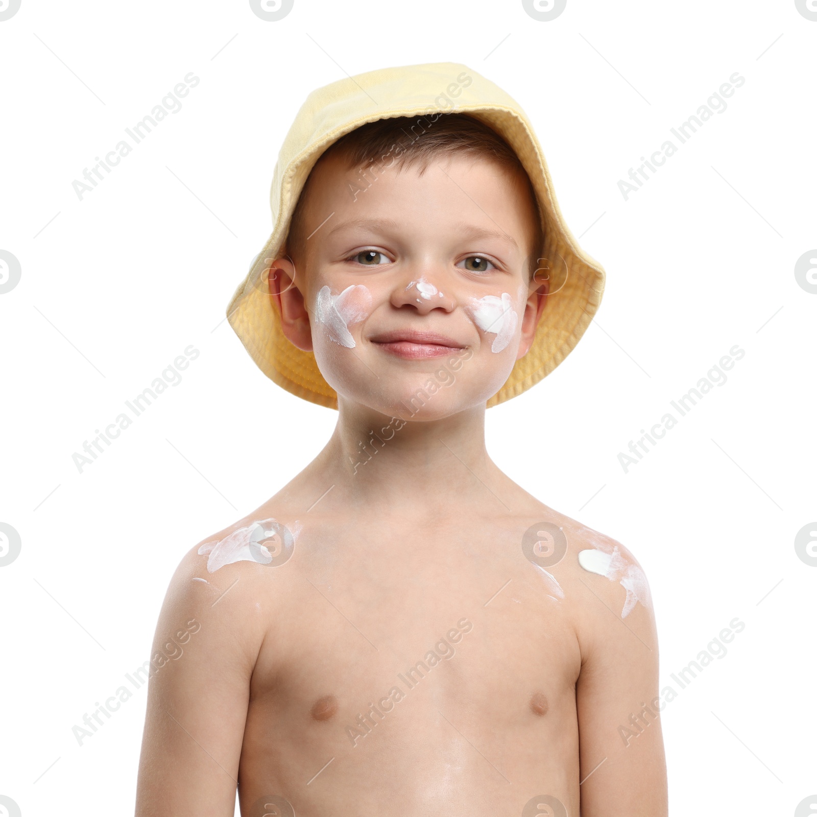 Photo of Little boy with sun protection cream on his skin against white background