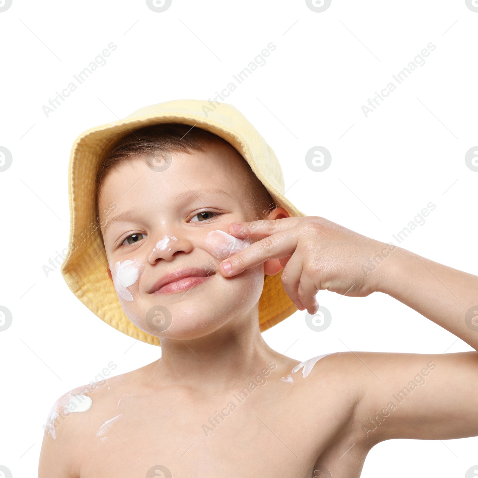 Little boy applying sun protection cream onto his skin on white background Photo of Little boy applying sun protection cream onto his skin on white background