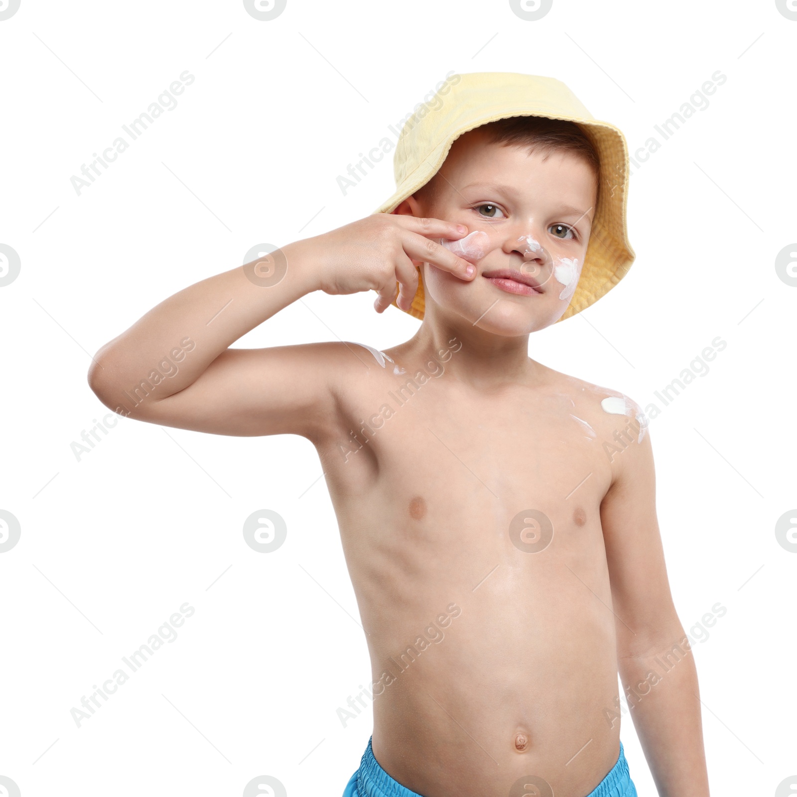 Little boy applying sun protection cream onto his skin on white background Photo of Little boy applying sun protection cream onto his skin on white background